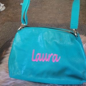 Turquoise boutique purse with Laura embroidery in hot pink.